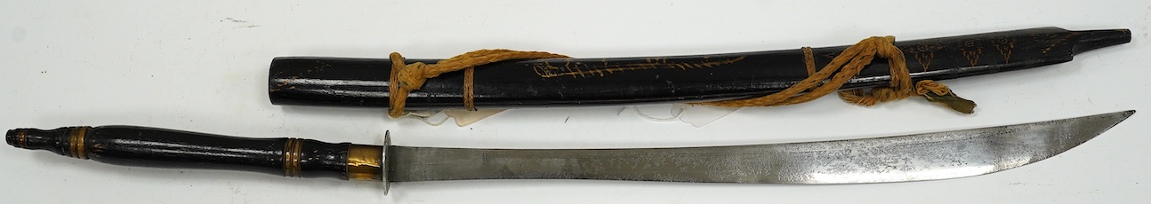 A Thai sword Dha, with a lacquered hilt and wooden scabbard, blade 56cm. Condition - fair